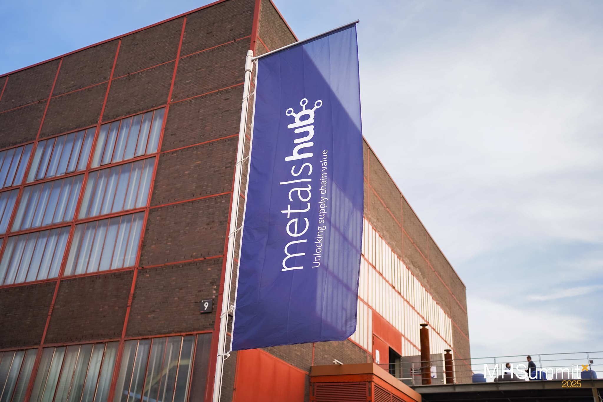 Metalshub flag in front of the venue building where the Metalshub Summit 2025 took place