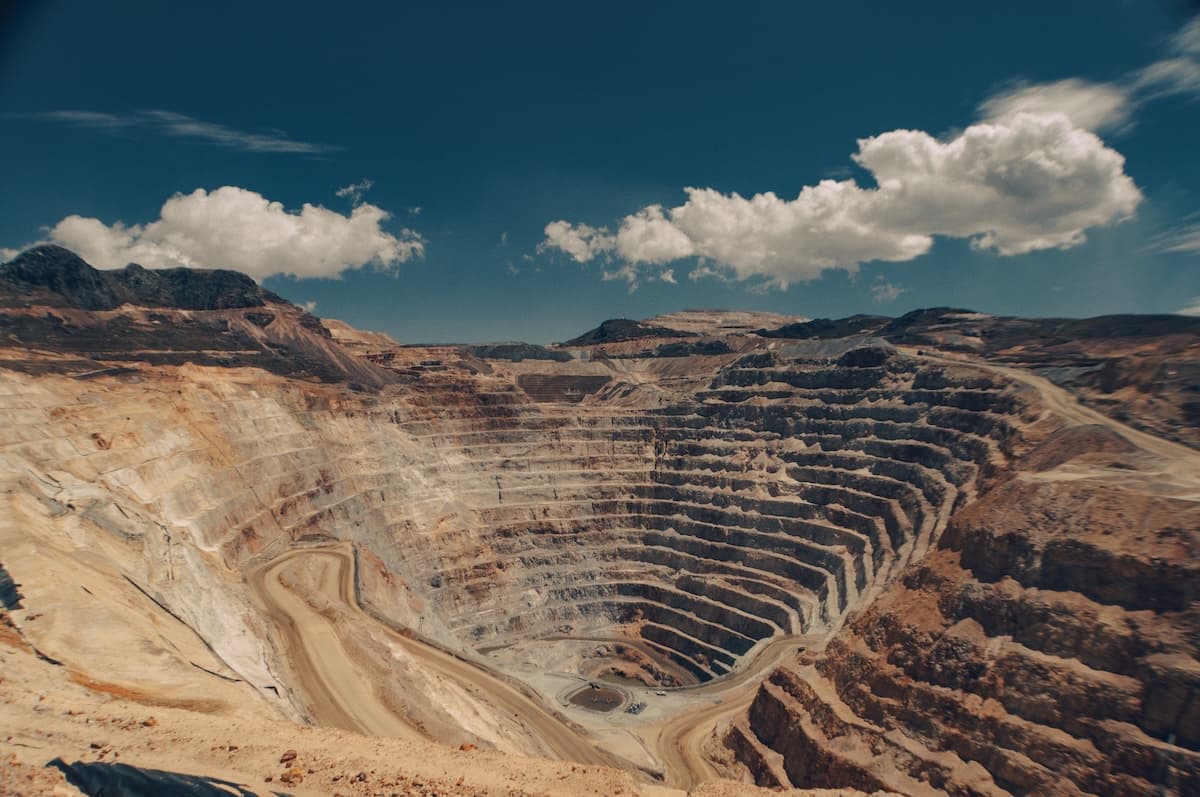 An image of a large open mine showing the stair-like benches